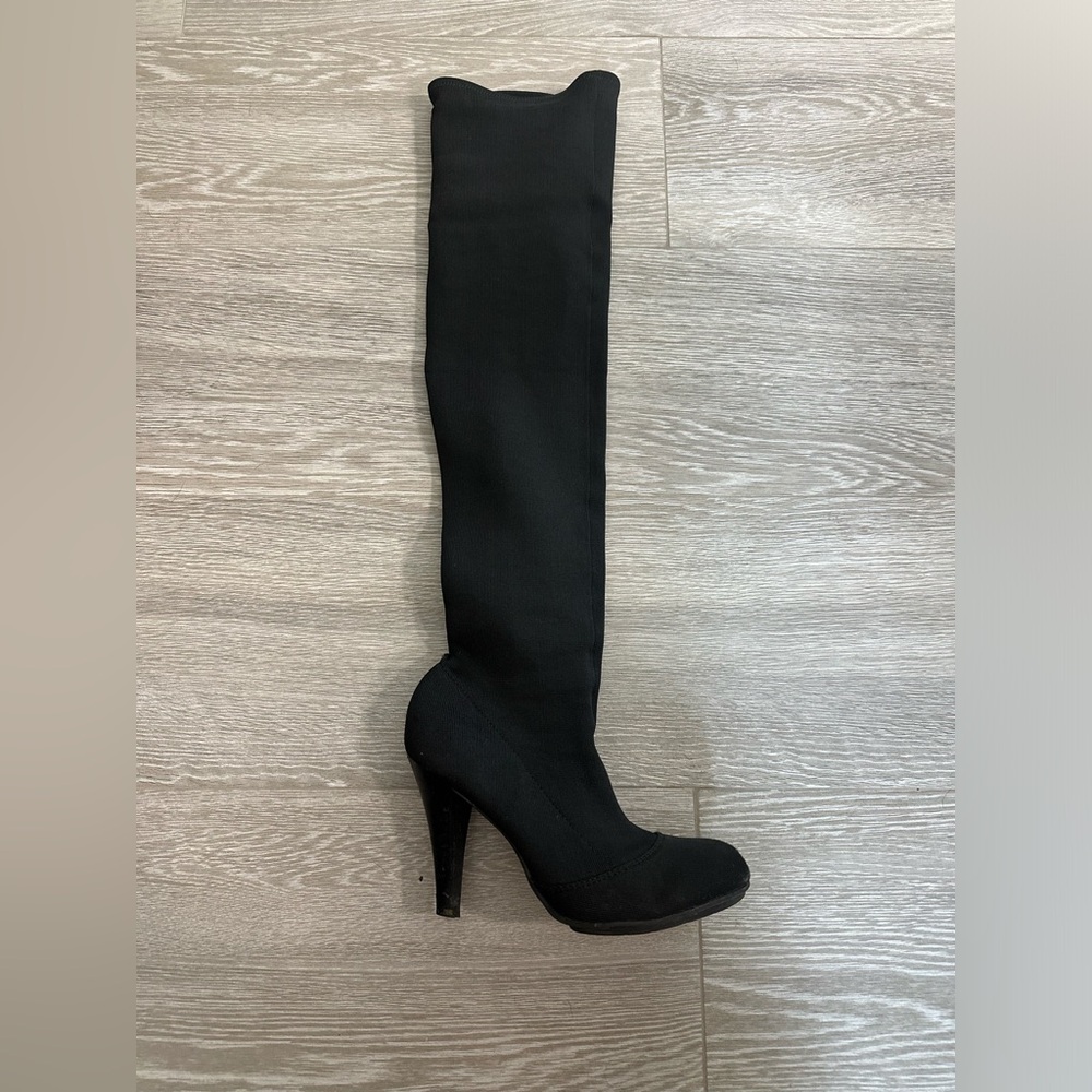 Report thigh high boots